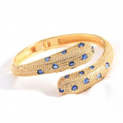 Copper snake wrap bracelet studded with diamond blue eyes white zircon