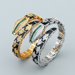 Copper snake-wrapped bracelet studded with diamond green black and white zircon springs